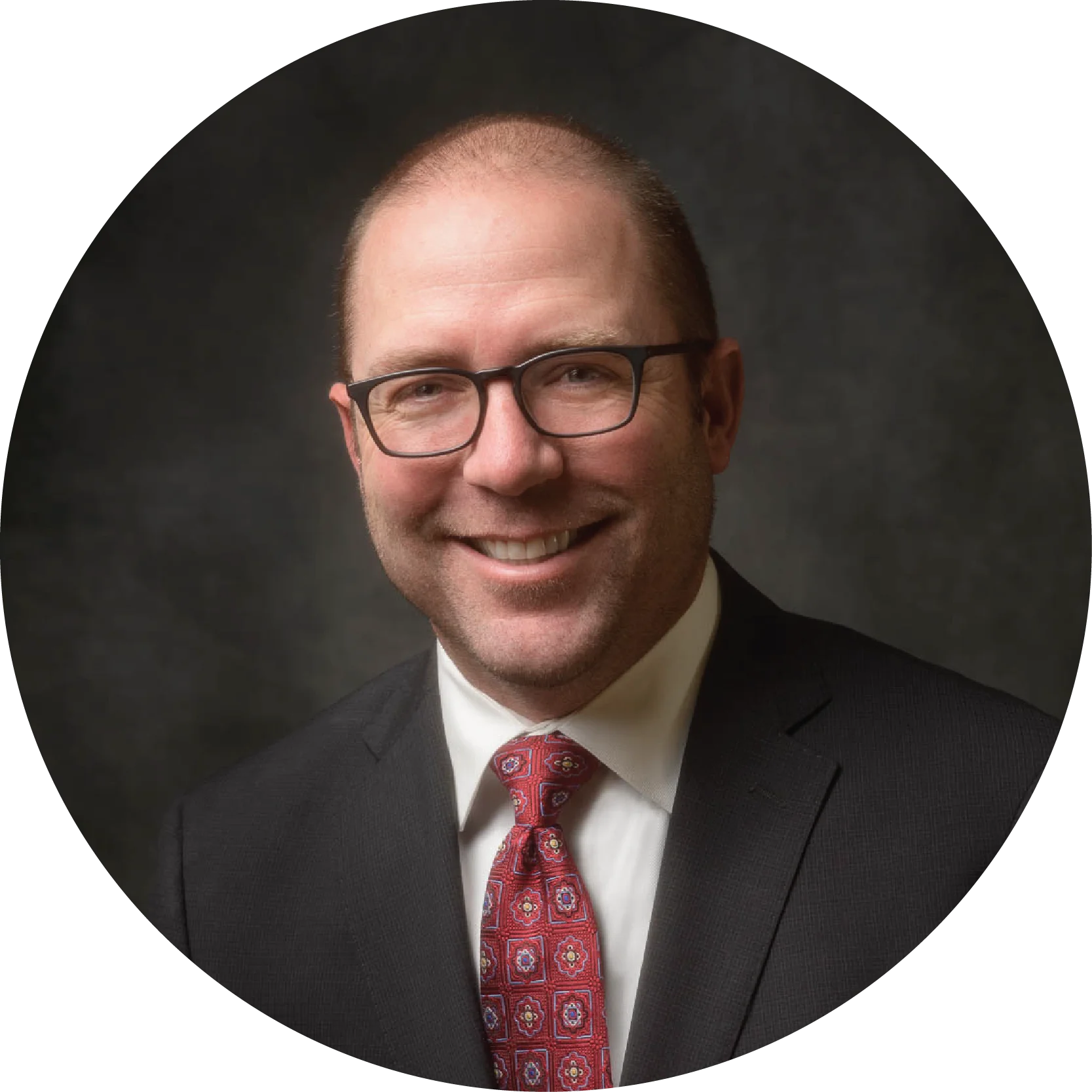 A professional portrait of Dan Oster from the NAI Alliance commercial real estate team