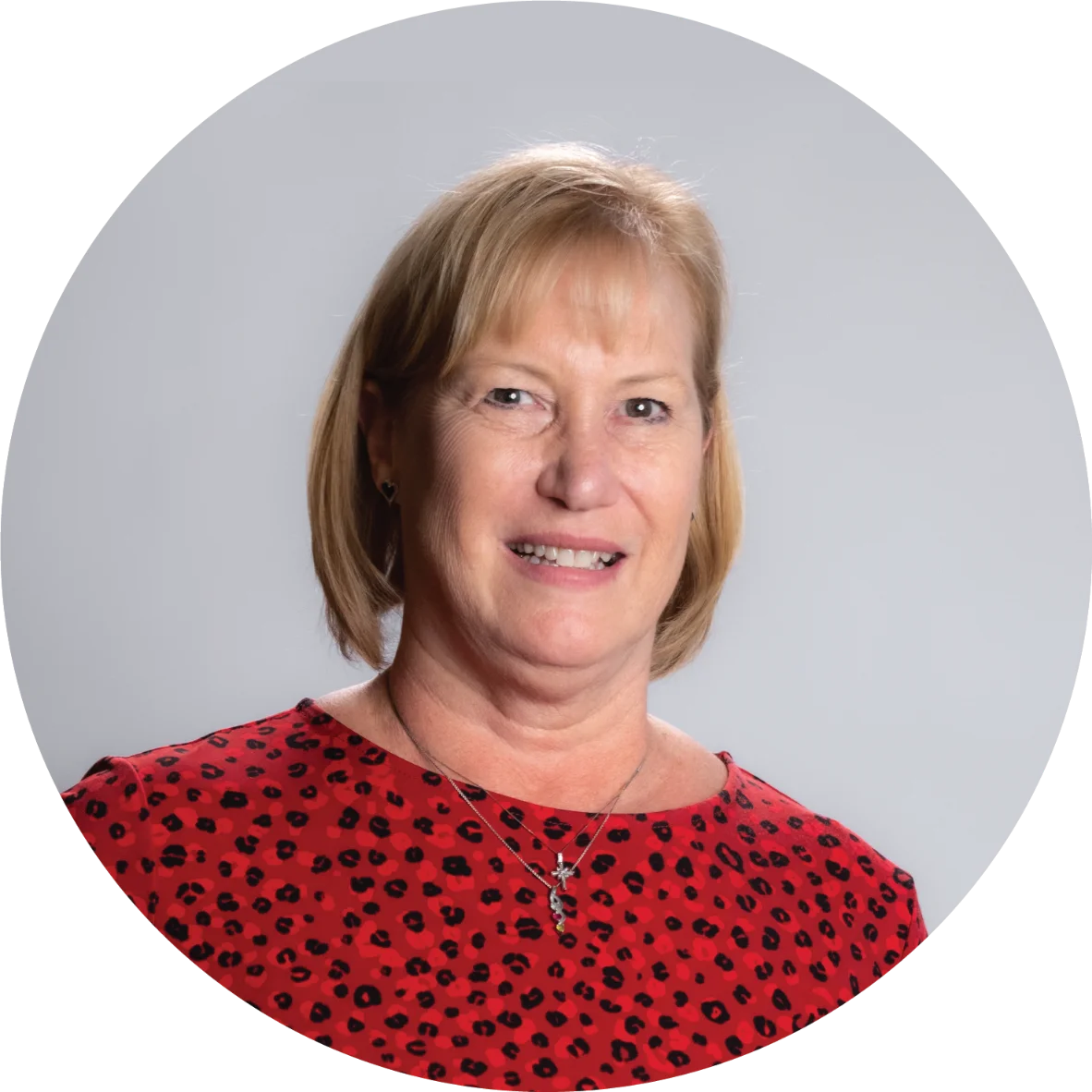 A professional portrait of Kim Geiger from the NAI Alliance commercial real estate team