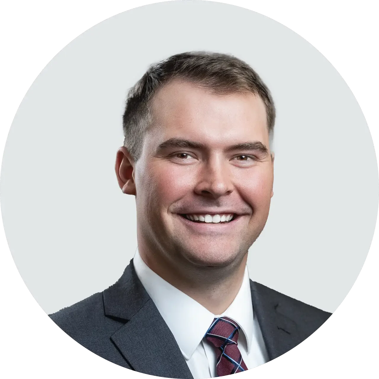 A professional portrait of Simon Solaegui from the NAI Alliance commercial real estate team